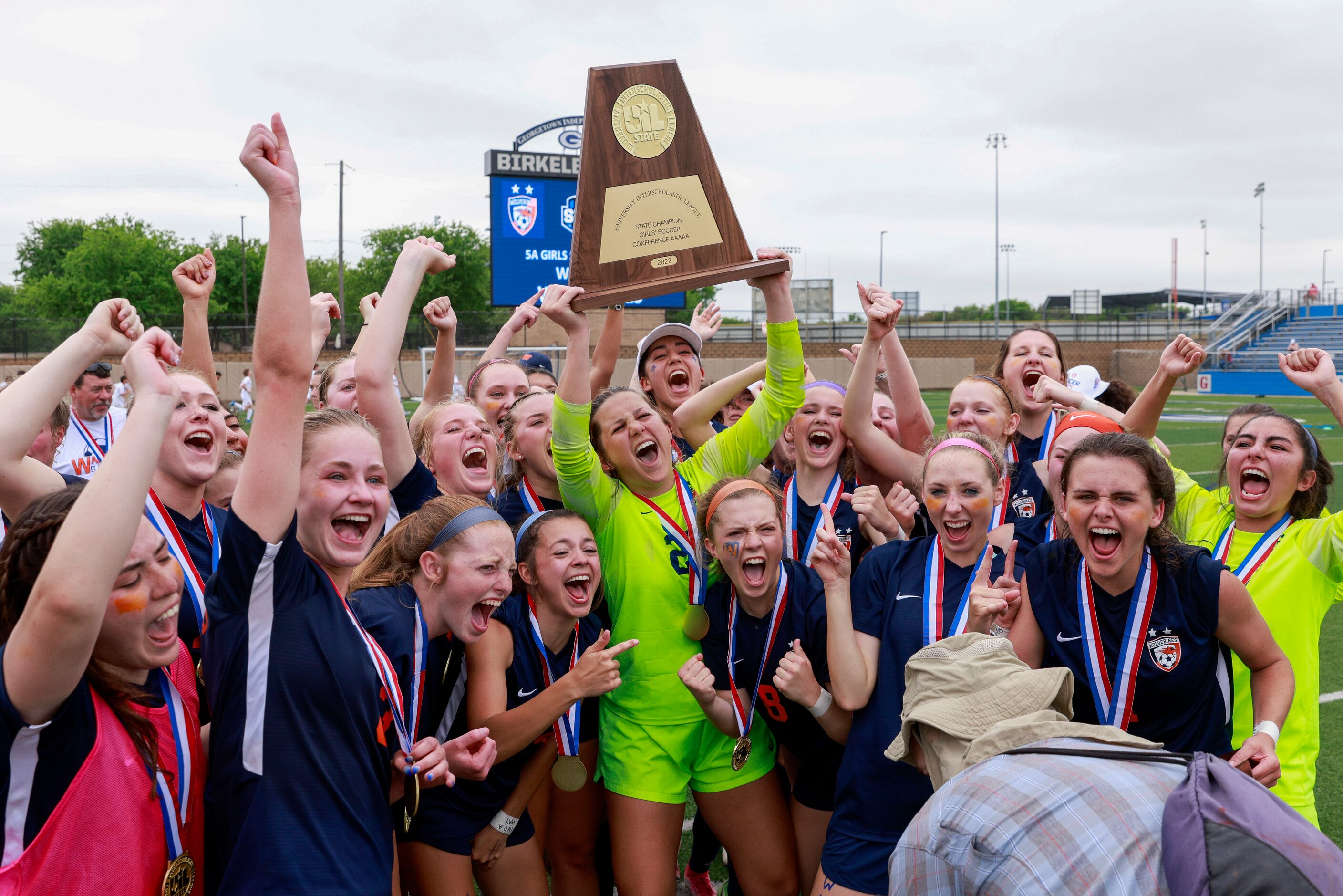 Frisco Wakeland goalkeeper Drew Stover (23) hoists the state championship trophy after...