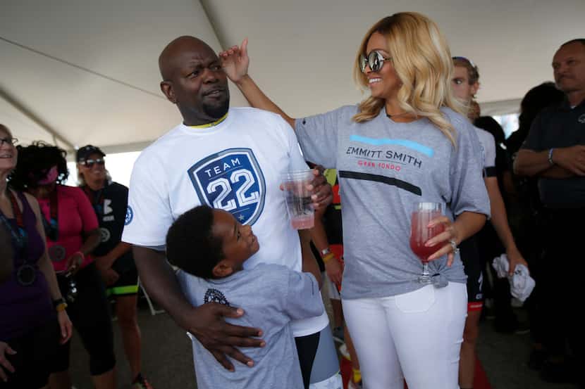 Pat Smith, right, playfully touches her husband, former Cowboys running back Emmitt Smith,...