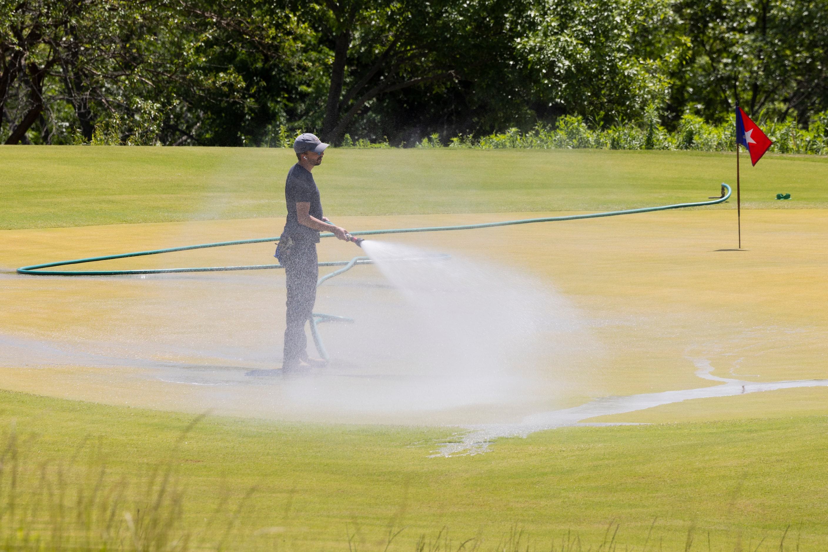 One of the holes is watered in the Omni PGA Frisco Resort’s 10-hole, par-3 course, The...