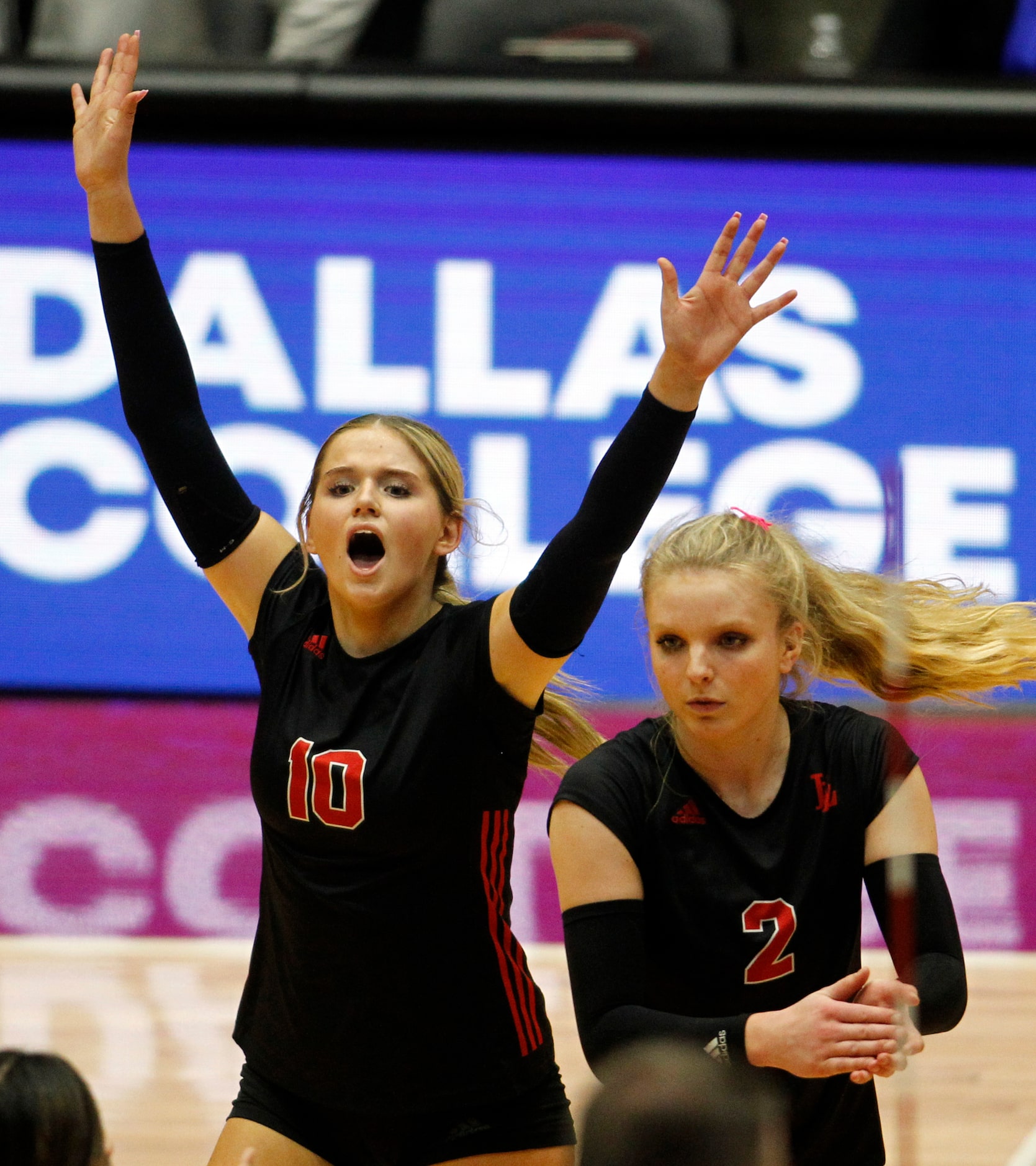 Lovejoy sophomore Skylar Jackson (10), left, and junior Shelby Burriss (2) react after the...