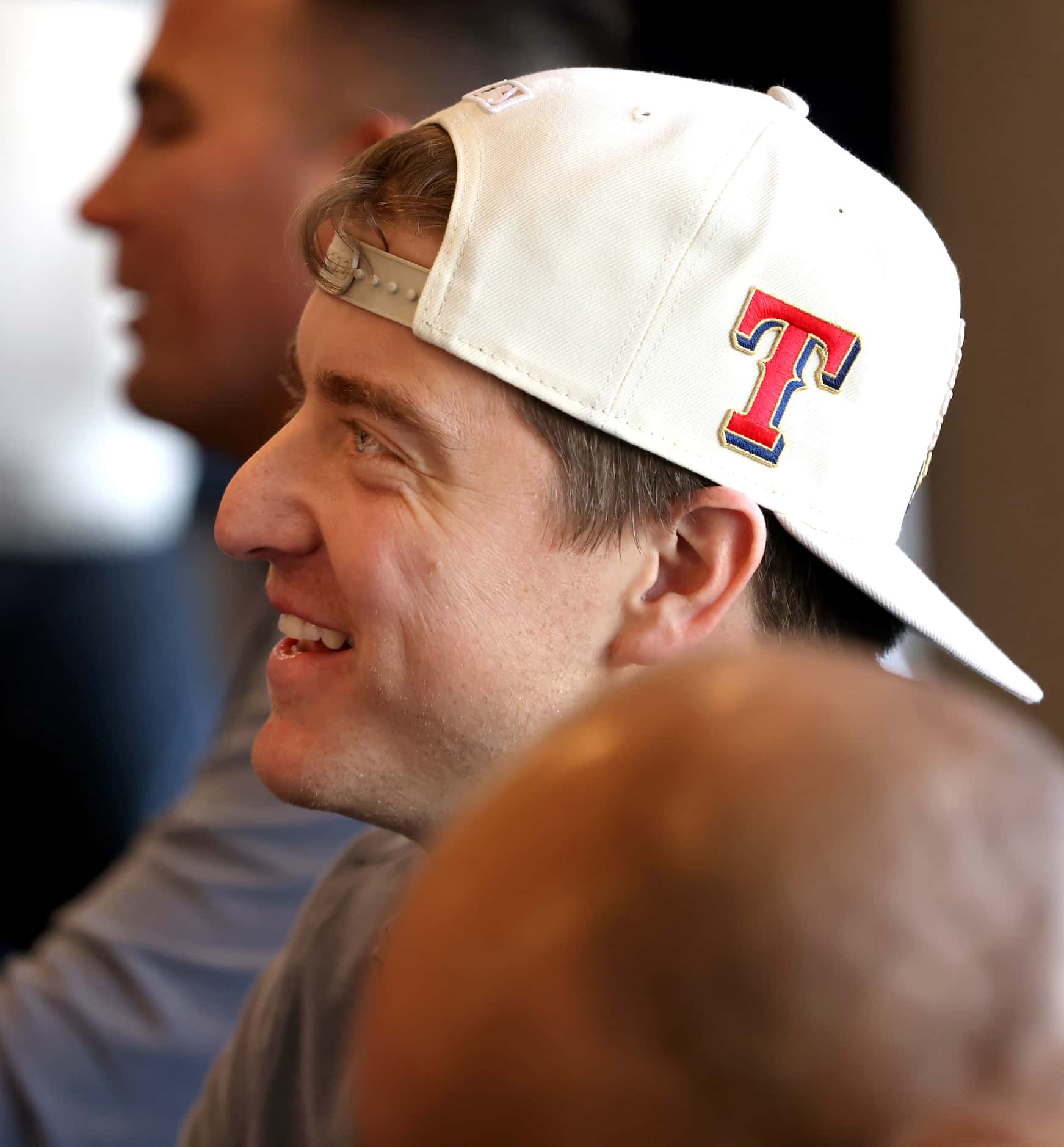 Texas Rangers pitcher Josh Sborz sports a smile as he is showered with accolades by Rangers...