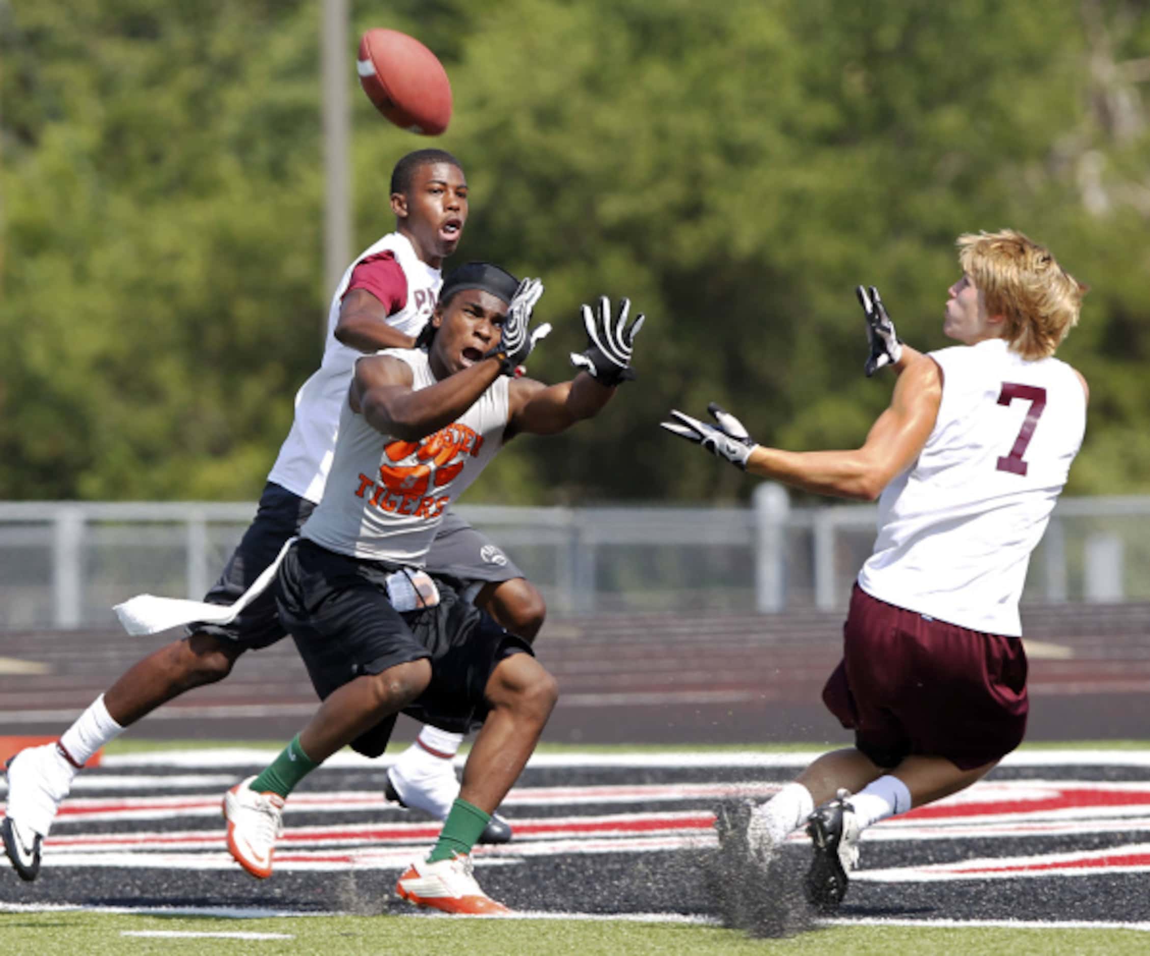 RED BULL GAME BREAKERS 7-ON-7 FOOTBALL: Plano defender Austin Connell (7, right) tries to...