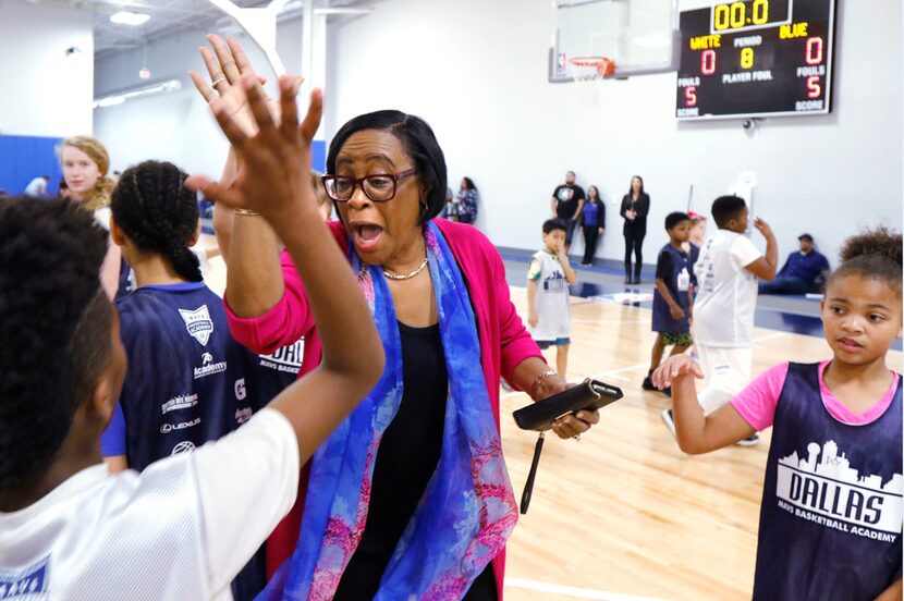 Dallas Mavericks CEO Cynt Marshall high-fived kids at the Mavs Spring Break Hoop Camp in...