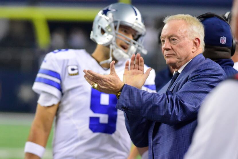 Dallas Cowboys owner Jerry Jones cheers from the sideline as Tony Romo prepared to enter the...