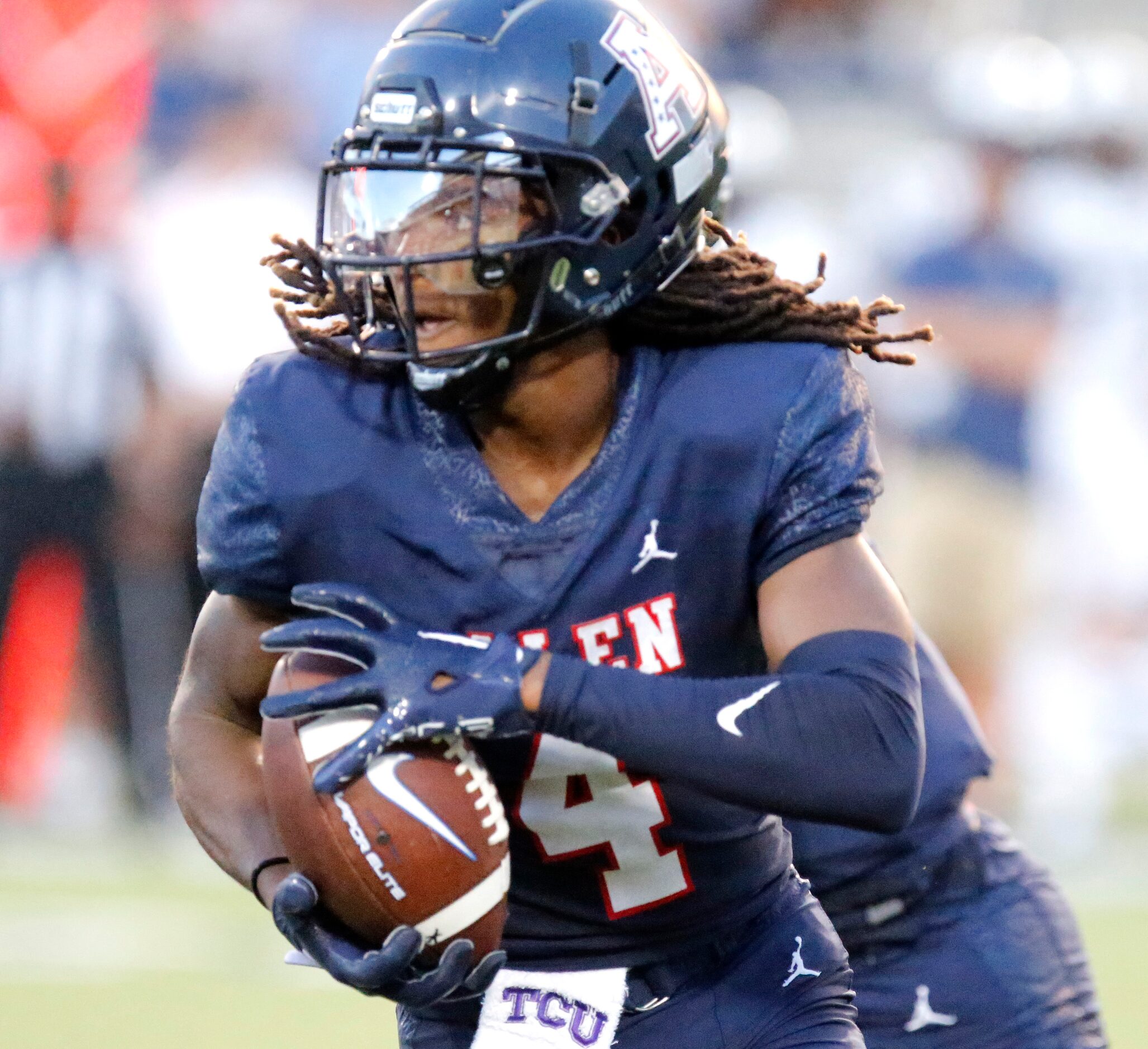 Allen High School wide receiver Messiah Washington  (4) carries the football during the...