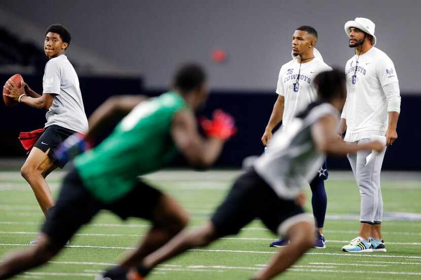 Dallas Cowboys quarterback Dak Prescott (right) and running back Tony Pollard watch their...