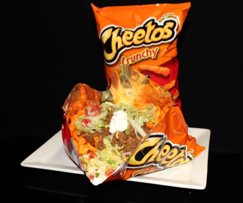 Does this look small? It isn't. That's a 1-pound bag of Cheetos topped with meat and cheese.
