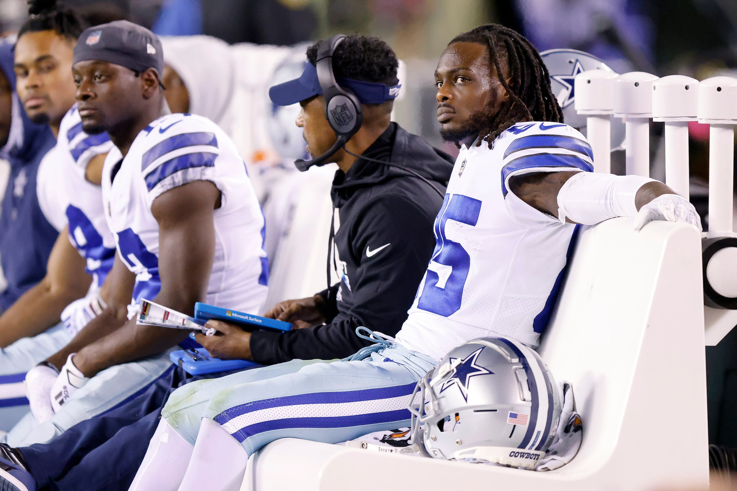 Dallas Cowboys wide receiver Noah Brown (85) and other receivers sit on the bench after a...