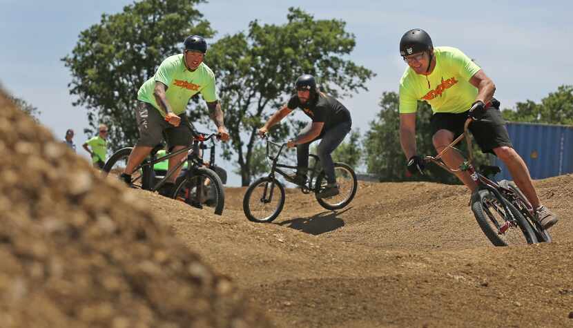 Bikers race through the course at the TexPlex Park.