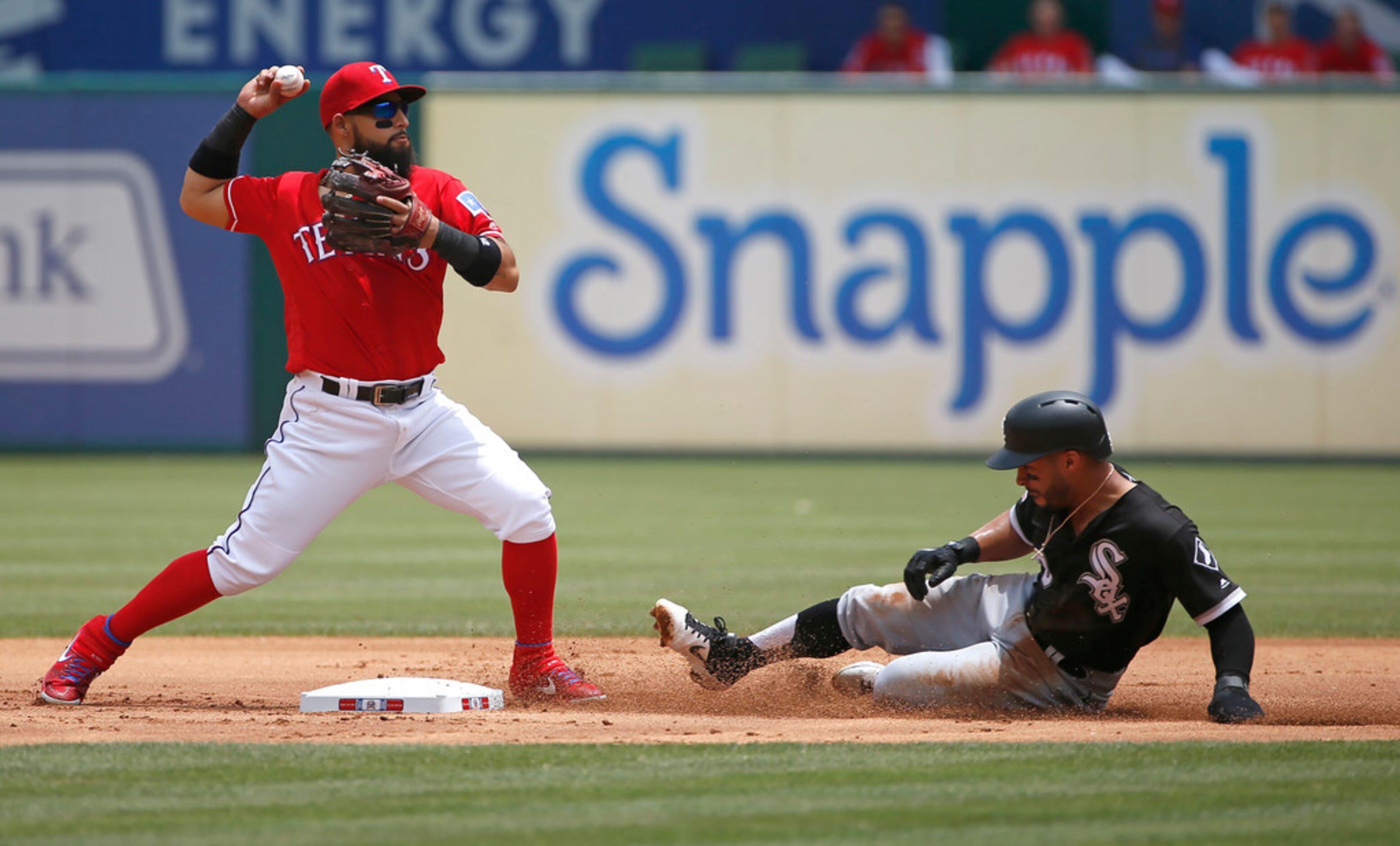 ARLINGTON, TX - JUNE 23: Rougned Odor #12 of the Texas Rangers throws to first base to...