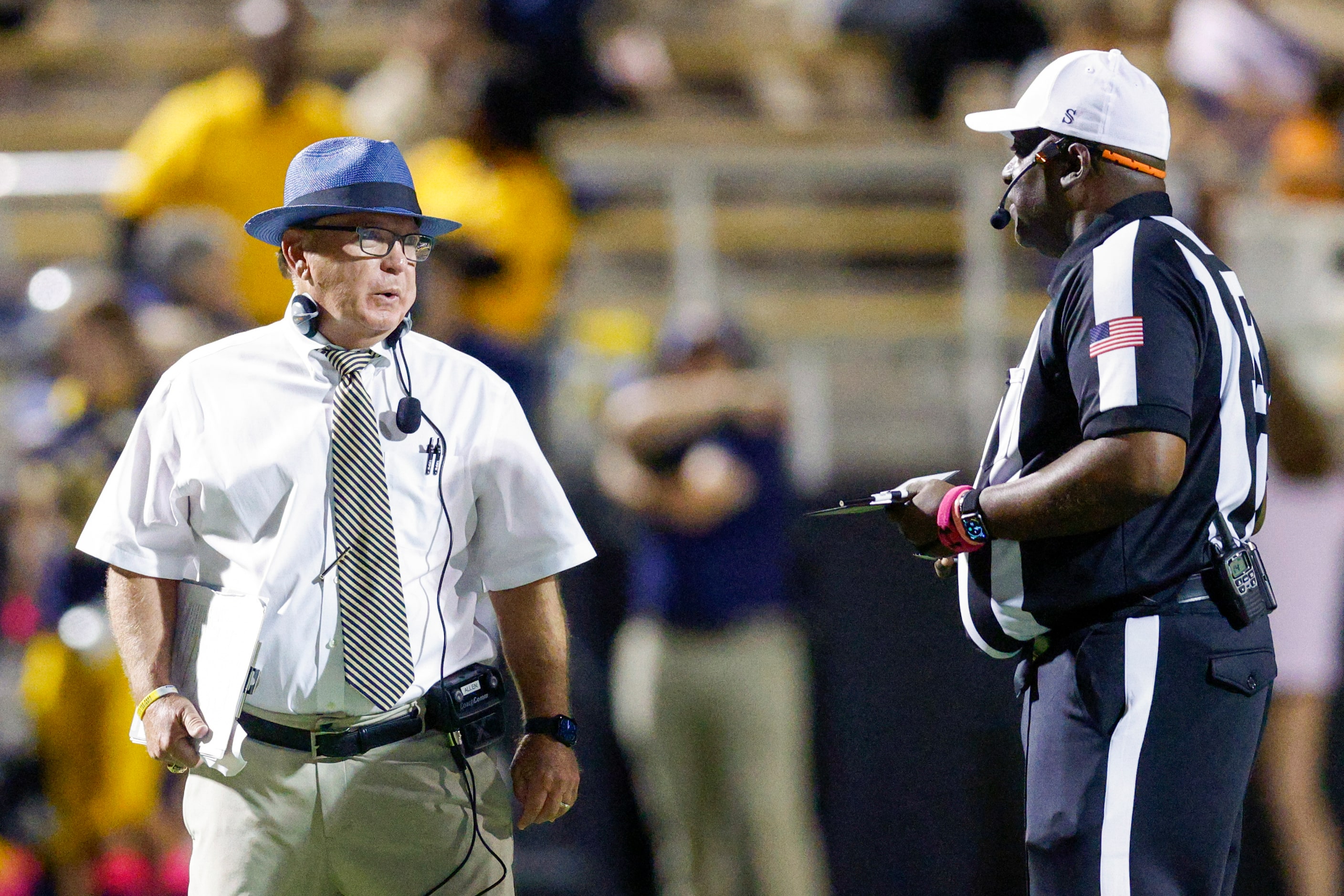 Highland Park head coach Randy Allen speaks with an official during a timeout during the...