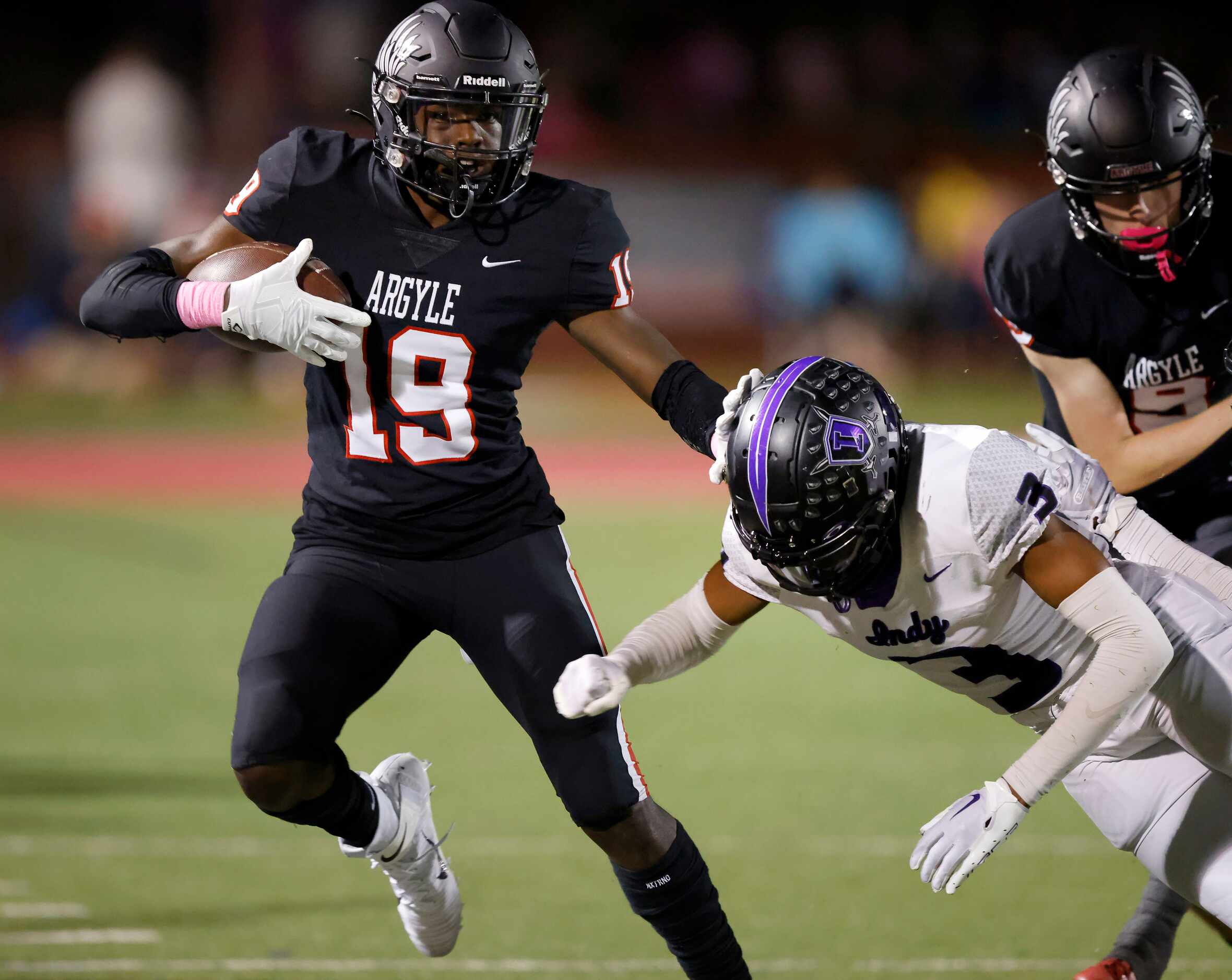 Argyle wide receiver Jaaqwan Felton (19) is forced out of bounds by Frisco Independence...