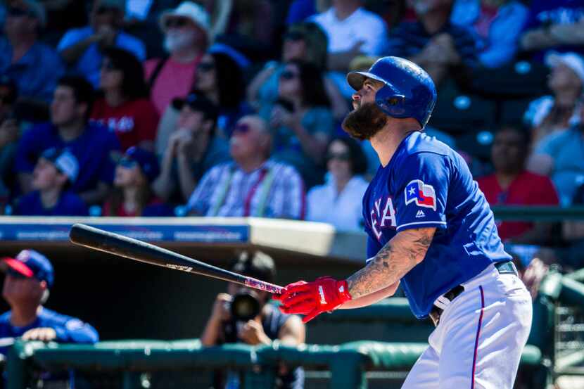 Texas Rangers first baseman Mike Napoli (5) looks up after hitting a home run during the...