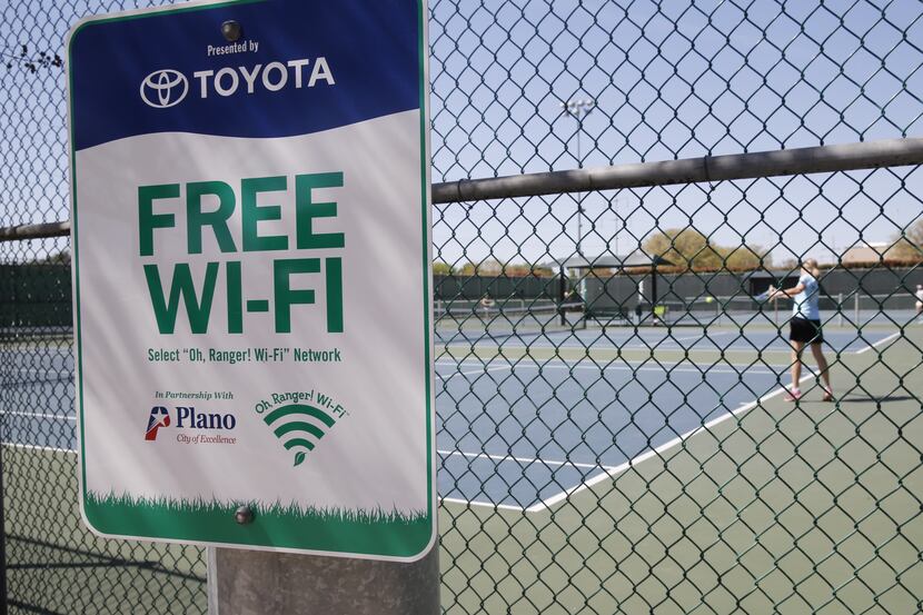 A free WiFi sign is pictured at the High Point Tennis Center in Plano. The center recently...
