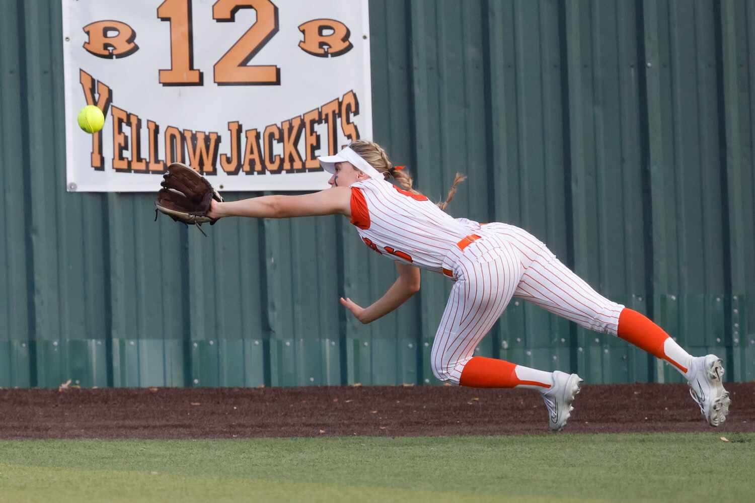 Rockwall’s Rachel Lawyer dives for a ball during a game against Waxahachie on May 5, 2023.