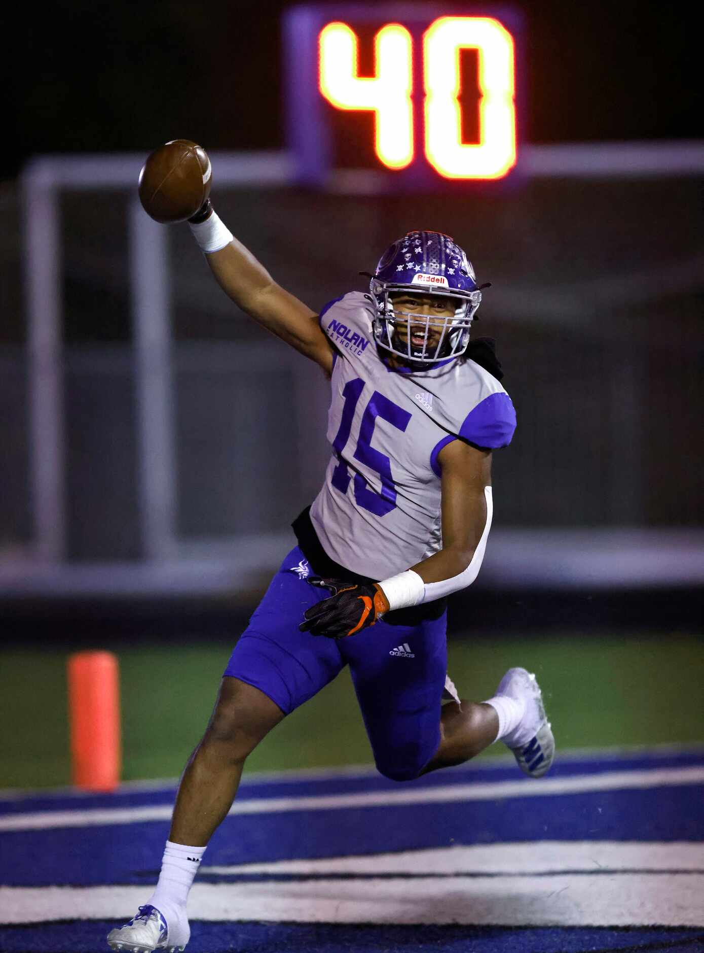 Fort Worth Nolan linebacker Samu Vave (15) reacts after scoring a second quarter touchdown....