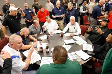 Football coaches from 6A-District 7 draw numbers to create this years football schedule...