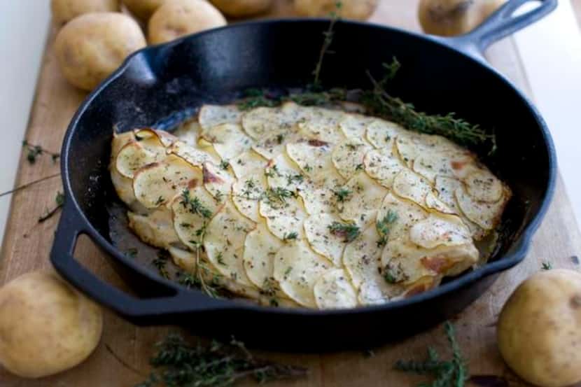Paper-thin  potatoes — cut with a mandoline — stand in for breading in this baked haddock dish.