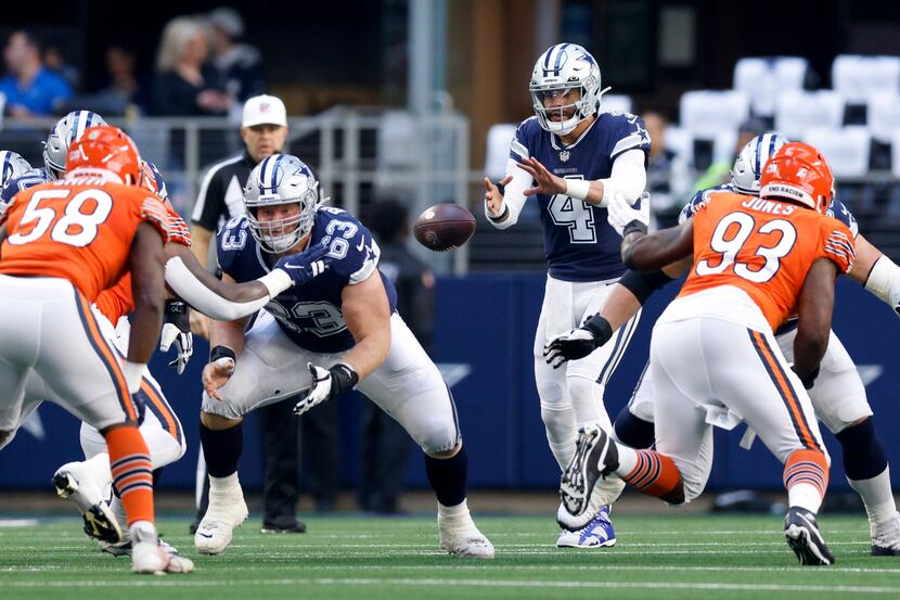 Dallas Cowboys quarterback Dak Prescott (4) takes the snap during the first half of an NFL...