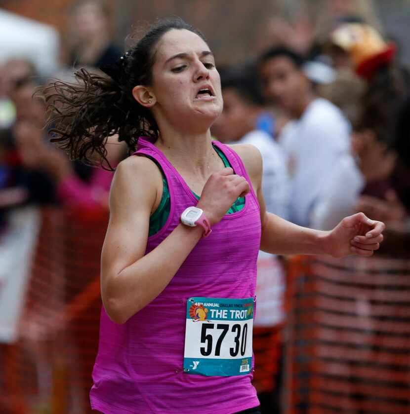 Michelle Gaye wins third place in the women's 8-mile run at the Dallas YMCA Turkey Trot in...
