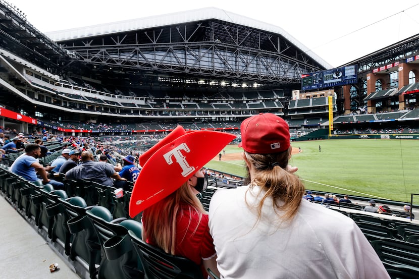 Texas Rangers fans take in an afternoon exhibition baseball game at Globe Life Field in...