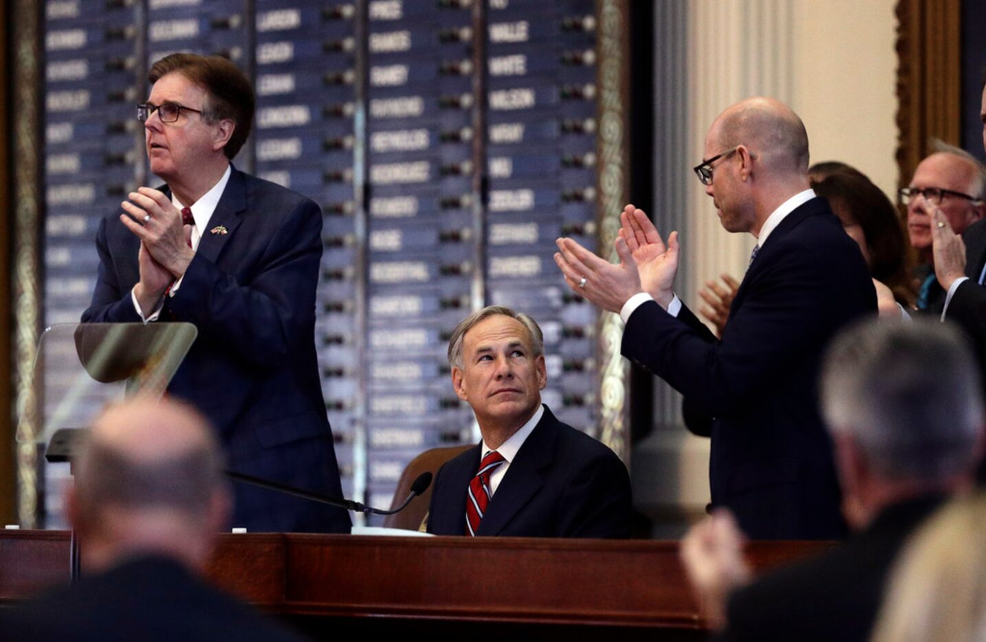 Texas Lt. Gov. Dan Patrick, left, and Texas Rep. Dennis Bonnen, R-Angleton, right, applaud...