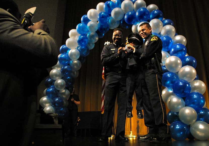 Former Dallas Police Chief Terrell Bolton, left, and newly-promoted senior corporal Joe R....
