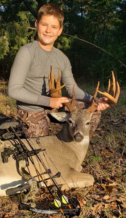 Jared Bagley of Emory, 13, displays the whopper 18-pointer he brought down in October with...