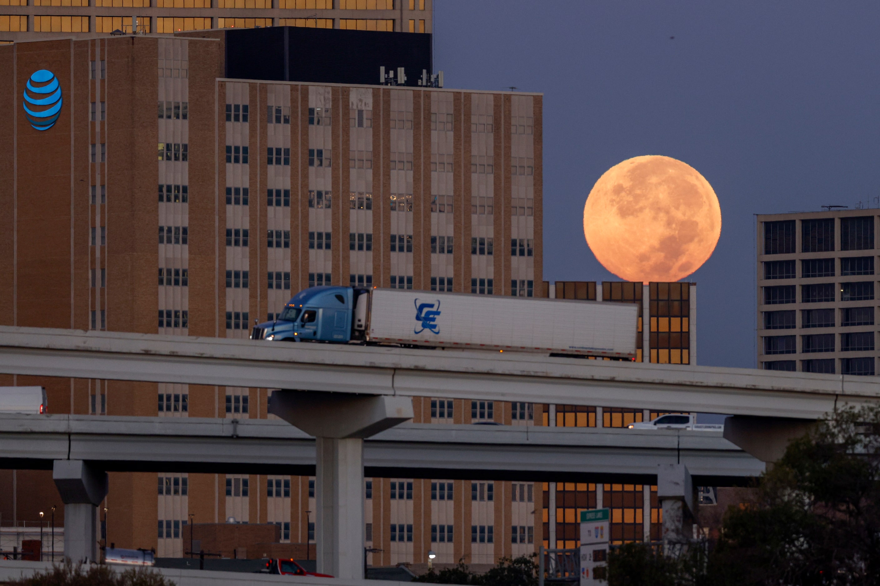 A supermoon sets behind downtown Fort Worth, Thursday, Oct. 17, 2024. A supermoon is a full...