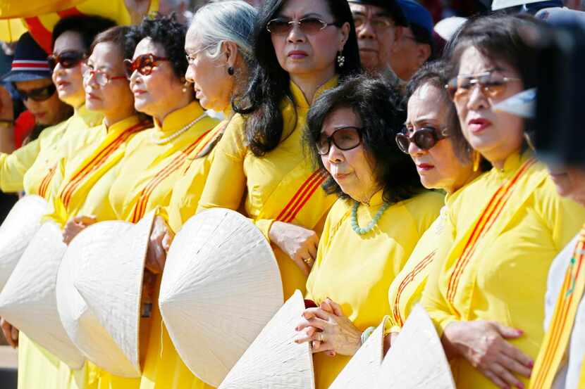 Members of a South Vietnamese women's group watch the ceremonies during the 'Welcome Home'...