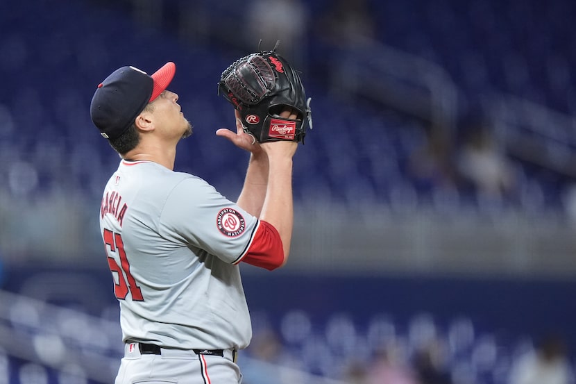 Washington Nationals relief pitcher Robert Garcia celebrates after the Nationals beat the...