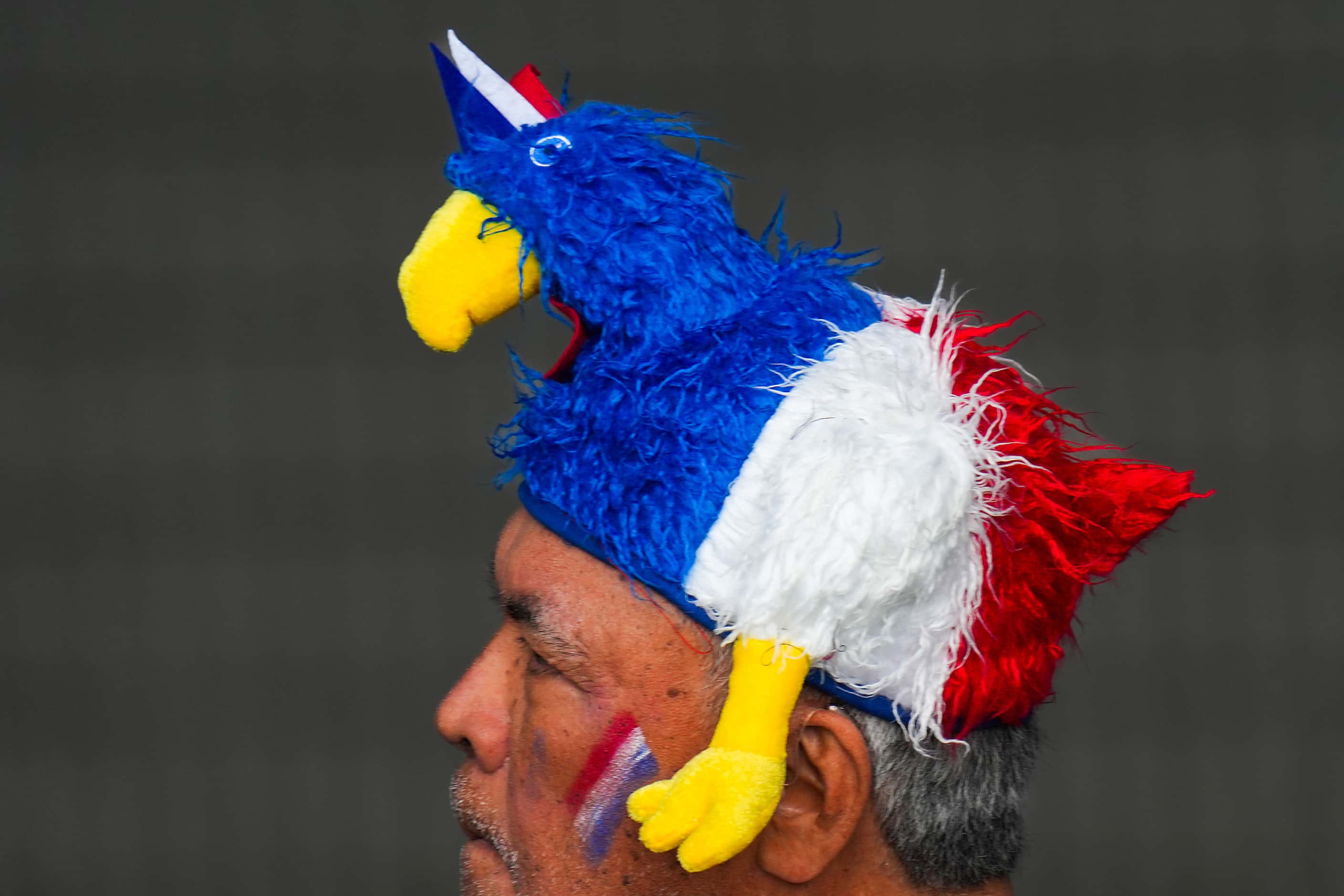 A French fan wears a coq hat during a men’s rugby sevens pool match against United States at...