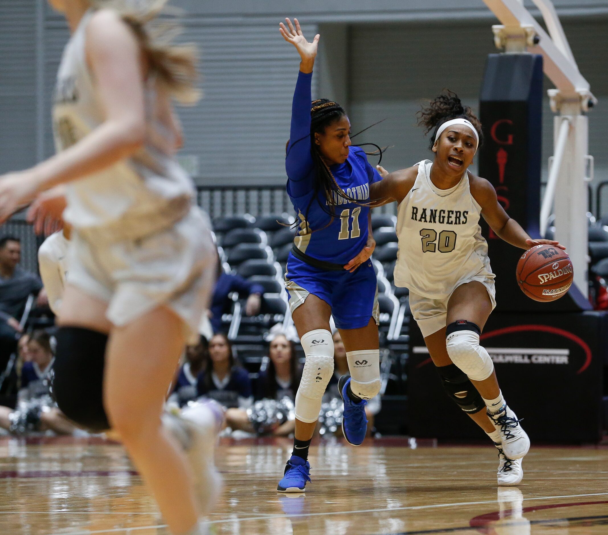 Frisco Lone Star's Halley Carr drives downcourt past Midlothian's Maykayla Jackson (11)...