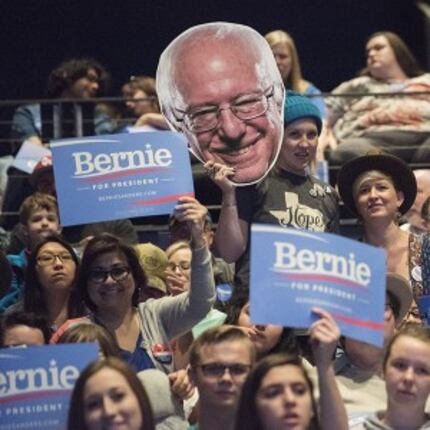  Supporters of Sen. Bernie Sanders wait for him to take the stage during his campaign stop...