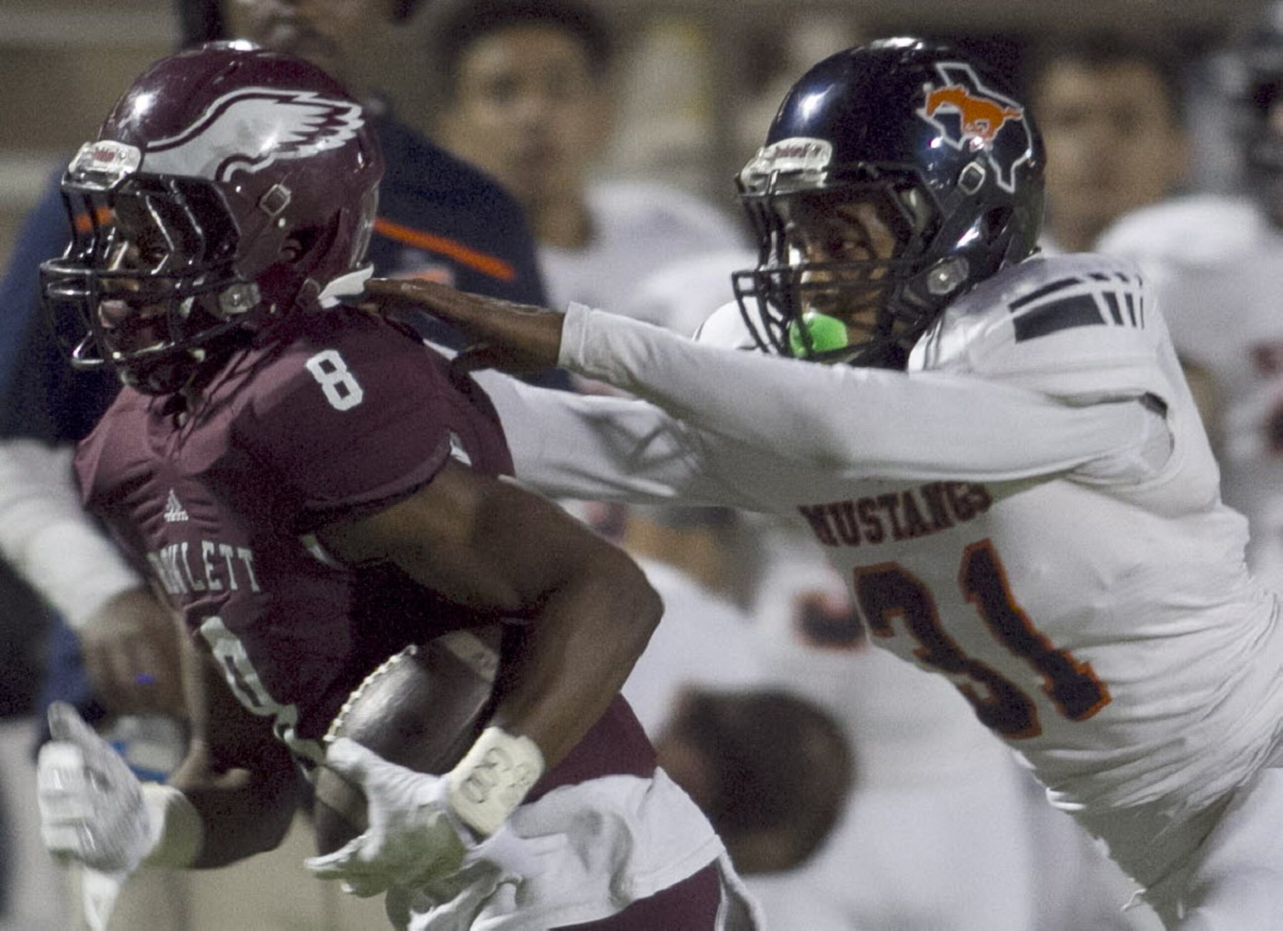 Rowlett receiver Quentin Stinson (8) is pulled down from behind by Sachse defensive back...