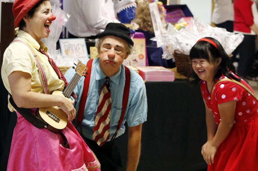 Kathy Mai (right) met clowns Tiffany Riley and Dick Monday before one of Dallas Children's...