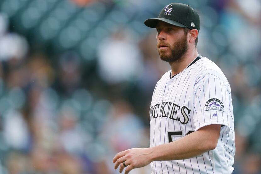 FILE - In this Sept. 17, 2017, file photo, Colorado Rockies relief pitcher Greg Holland...