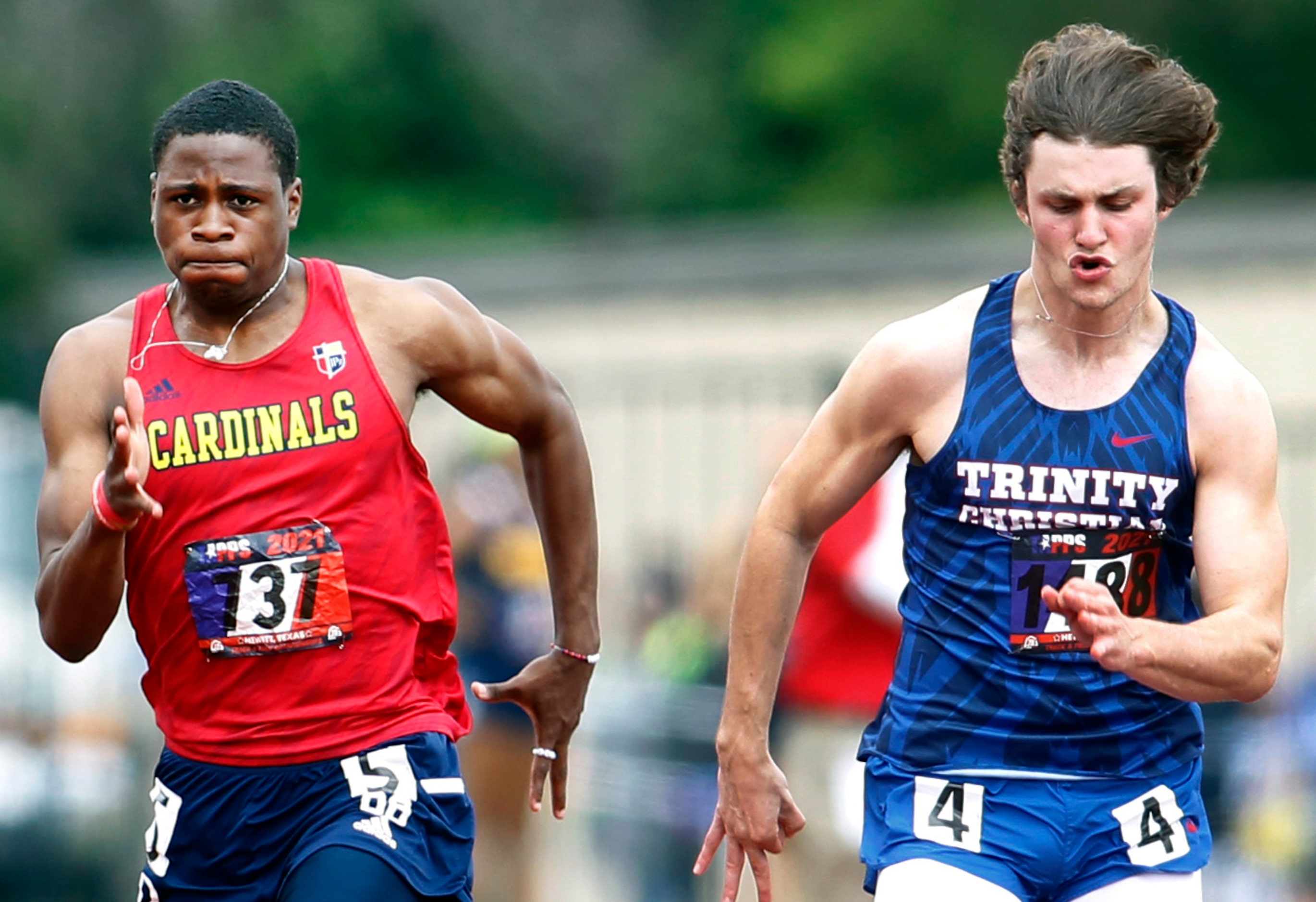 Trinity Christian Addison's Luke Tredennick, right, competes against a field of contenders...