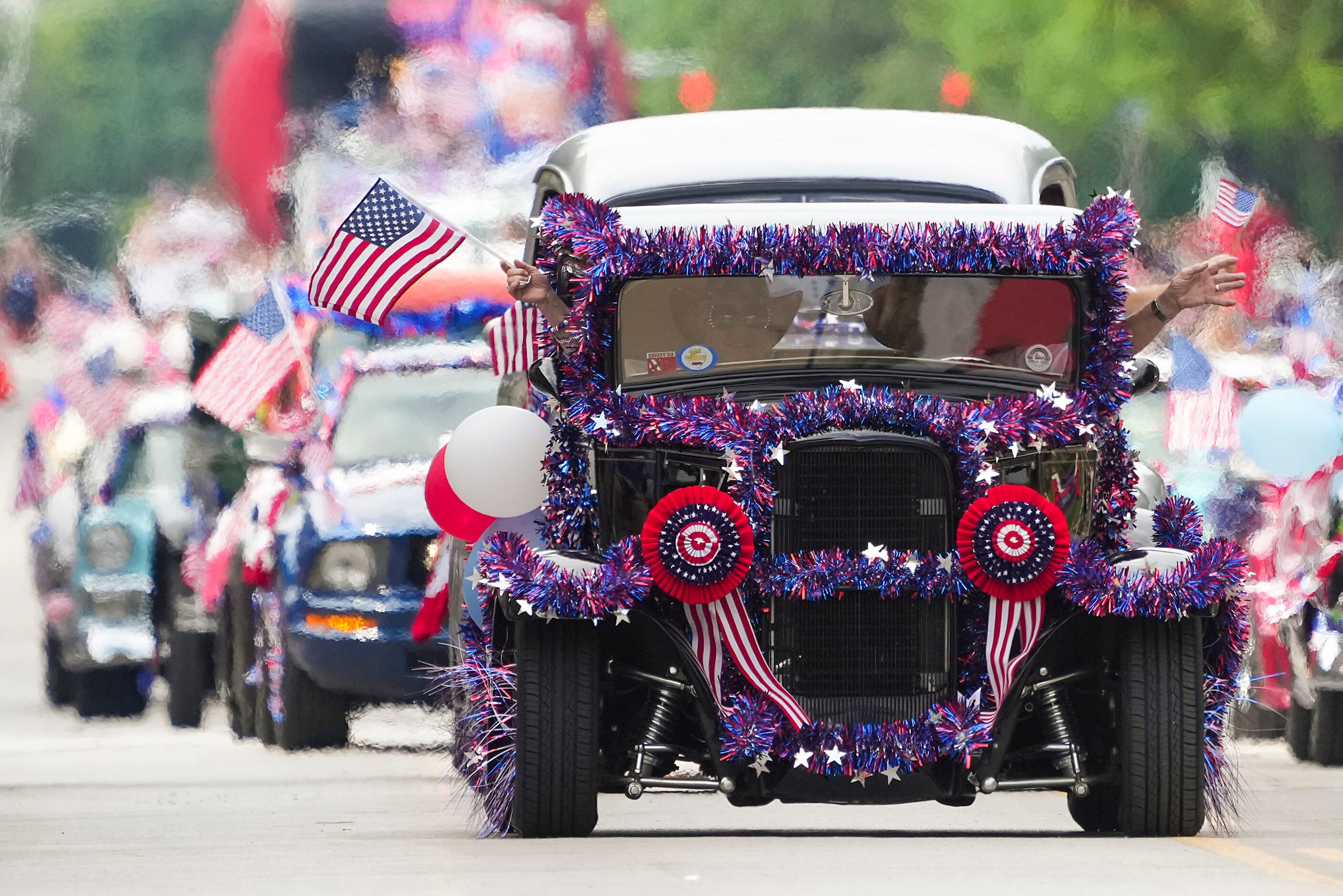 Vehicles of the Vintage Chevrolet Club of America Lone Star Chapter are decked out in red,...