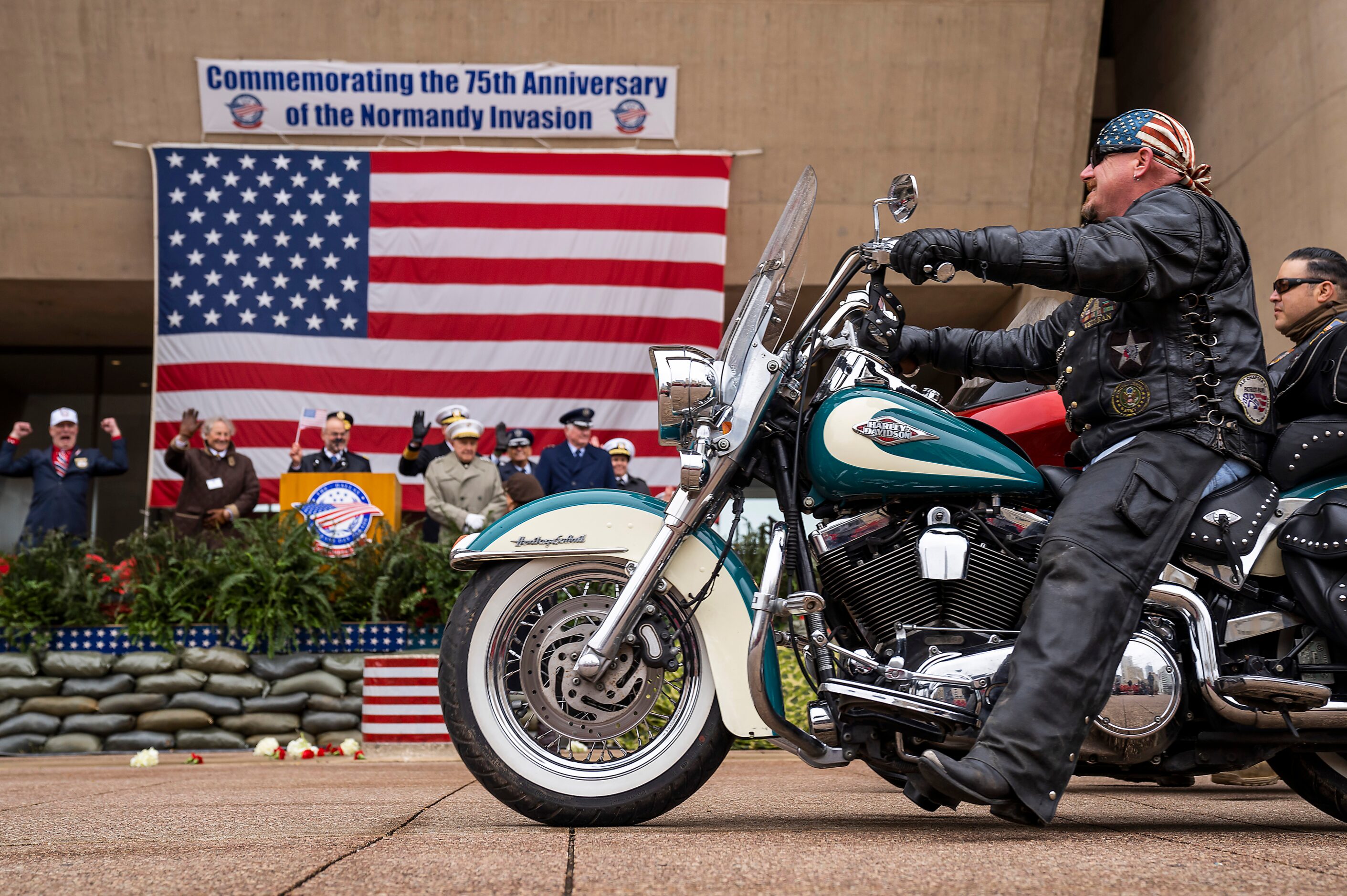 A group of bikers passes City Hall during The Greater Dallas Veterans Day Parade on Monday,...