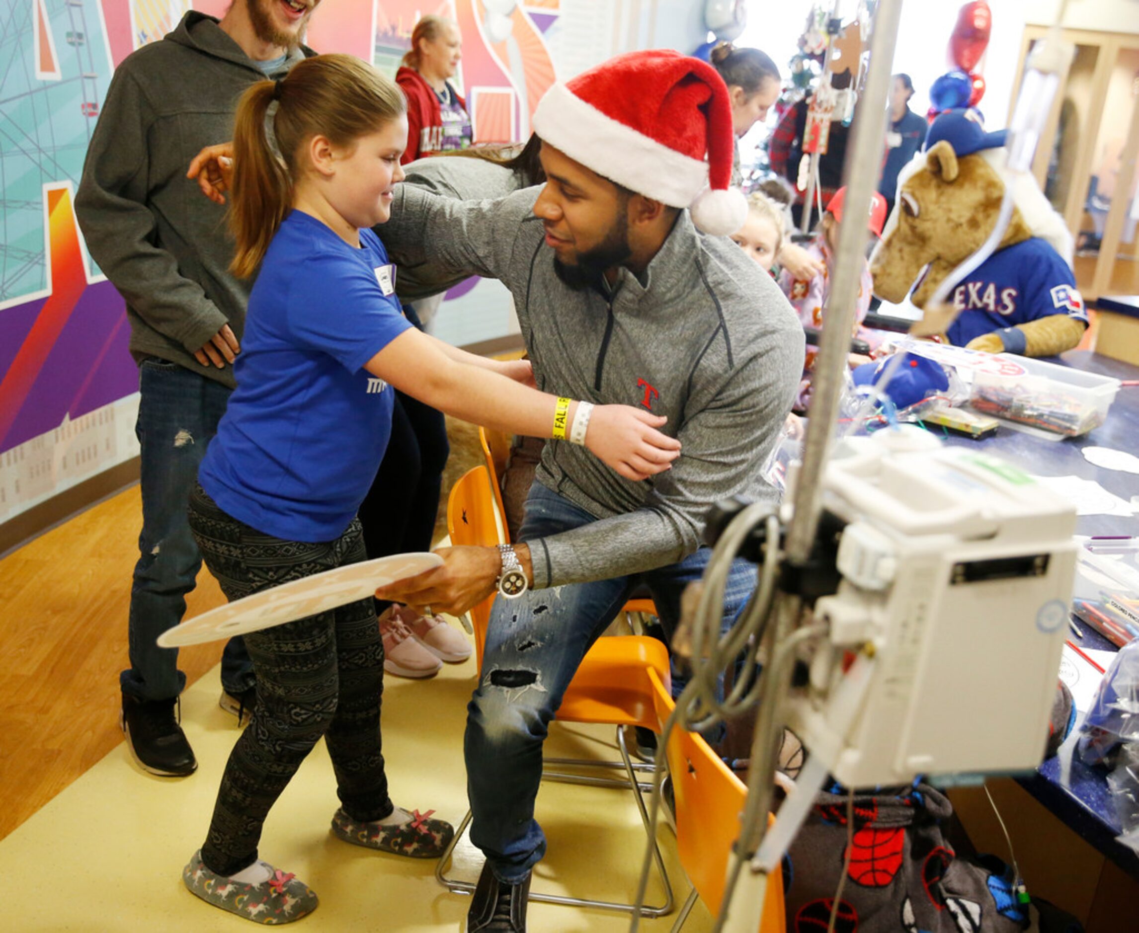 Cadence Crowley, 11, hugs Texas Rangers shortstop, Elvis Andrus during at the Texas Rangers...