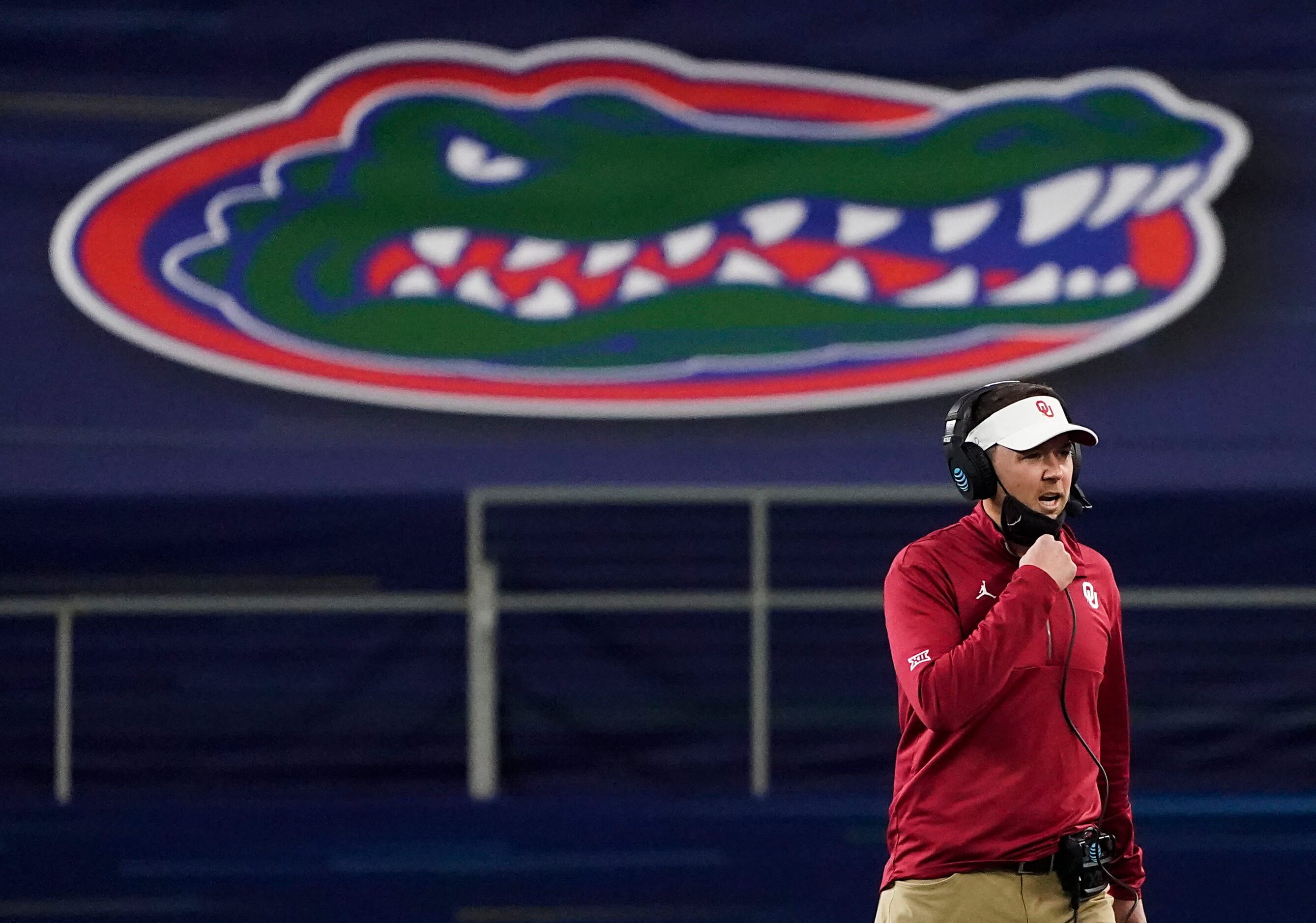 Oklahoma head coach Lincoln Riley works on the sidelines during the first half of the Cotton...