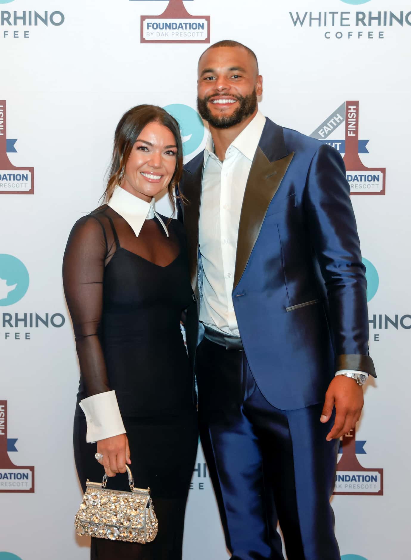 Founder and Dallas Cowboys quarterback Dak Prescott poses with family and friends at the...