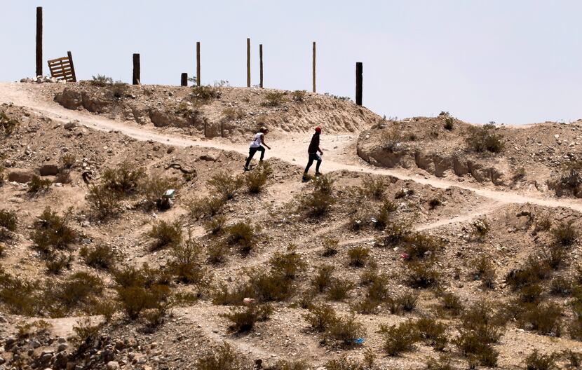 In hopes of moving migrants, smugglers on the outskirts of Juarez study the terrain where...