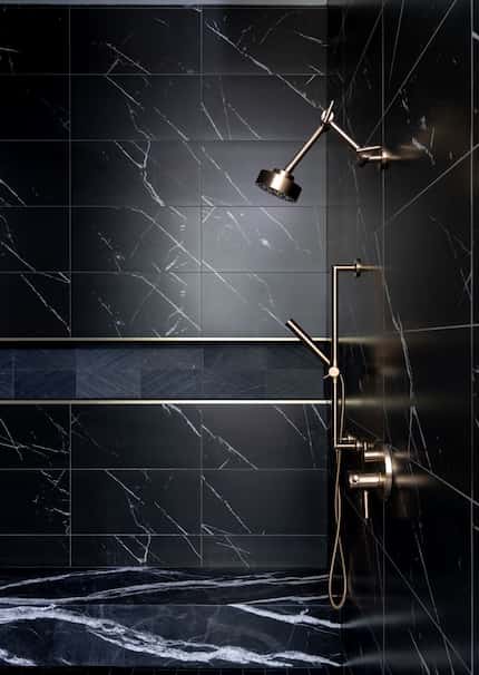 This sleek, black shower designed by Studio Steidley brings the drama to the primary bath.