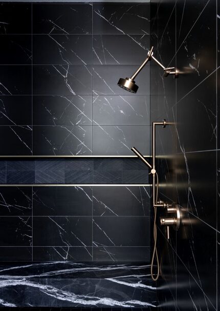 This sleek, black shower designed by Studio Steidley brings the drama to the primary bath.