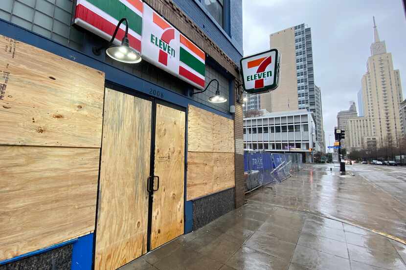 The 7-Eleven at 2008 Commerce Street in downtown sits boarded up. It closed on Monday.