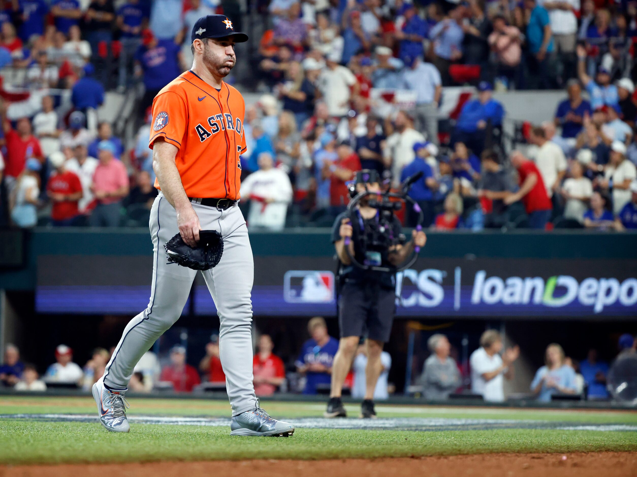 Houston Astros starting pitcher Justin Verlander (35) exhales on the way to the dugout after...