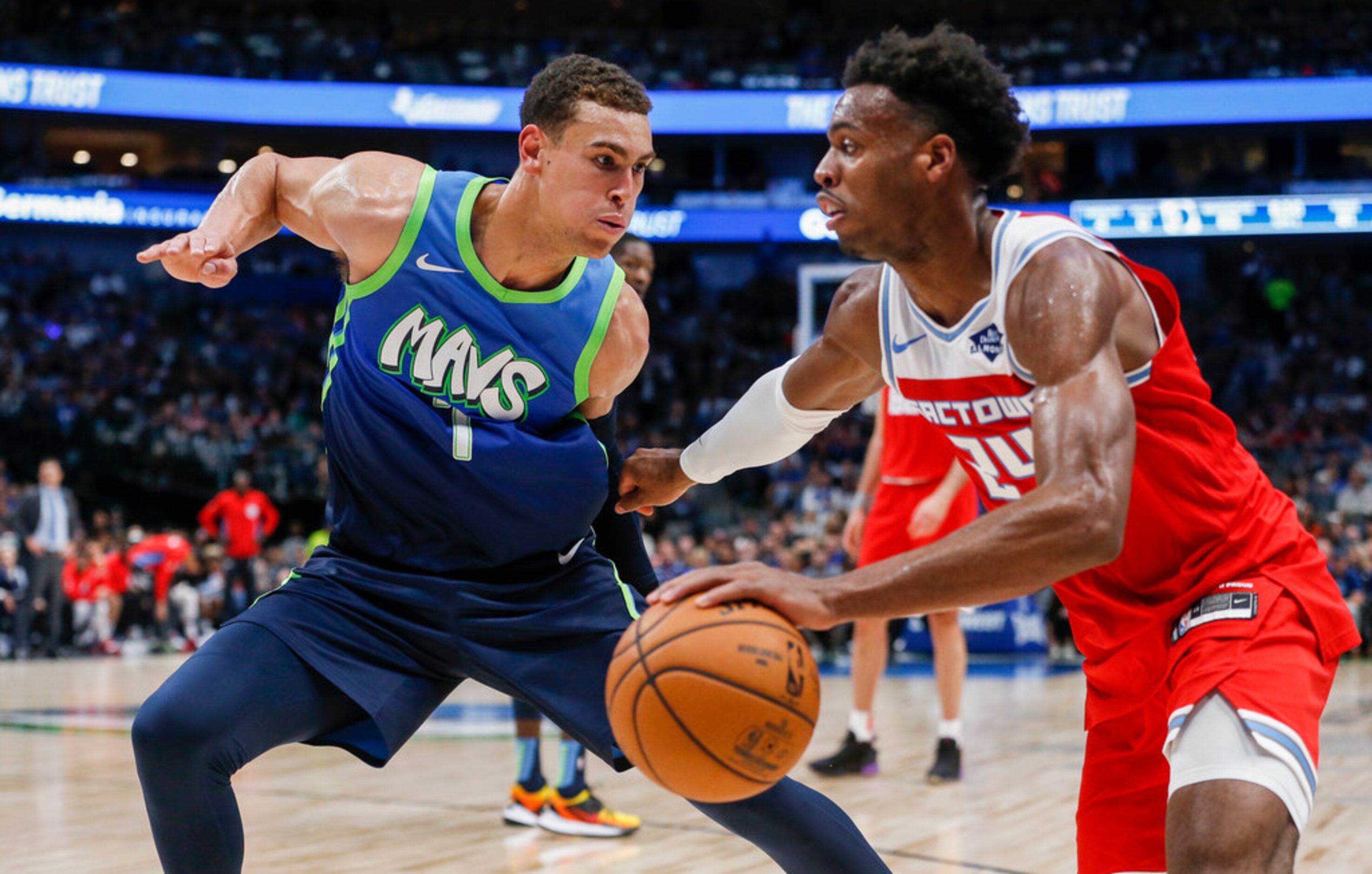 Sacramento Kings guard Buddy Hield (24) drives past Dallas Mavericks forward Dwight Powell...