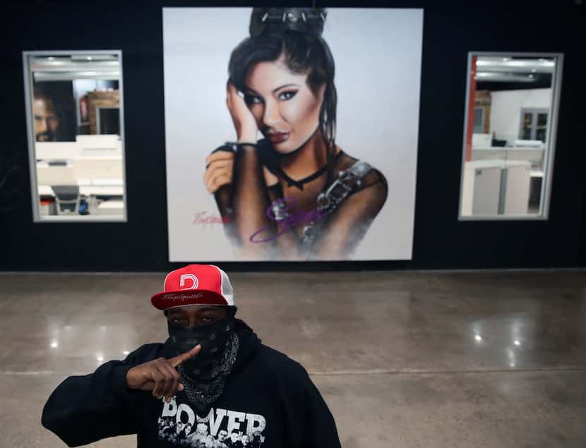 Artist Theo Ponchaveli in front of a Selena artwork. Ponchaveli, who normally covers his...